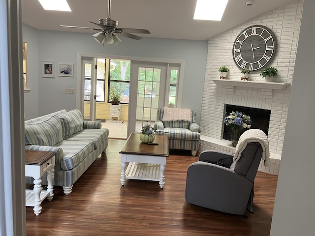 1076 Mainsail Ln, Saint Johns, FL 32259 - living room featuring a skylight, wood finished floors, a ceiling fan, vaulted ceiling, and a brick fireplace