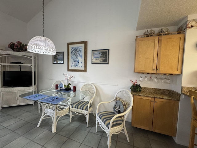 59 Village Del Lago Cir Unit 59, Saint Augustine, FL 32080 - tiled dining space featuring high vaulted ceiling