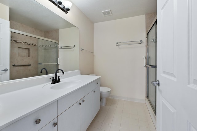 21211 Harbour Vista Cir, Saint Augustine, FL 32080 - bathroom featuring vanity, tile patterned flooring, and a shower with door