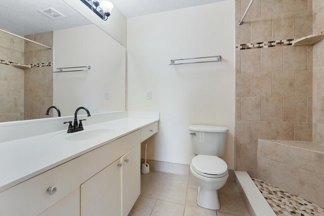 21211 Harbour Vista Cir, Saint Augustine, FL 32080 - bathroom with vanity, tile patterned floors, and tiled shower