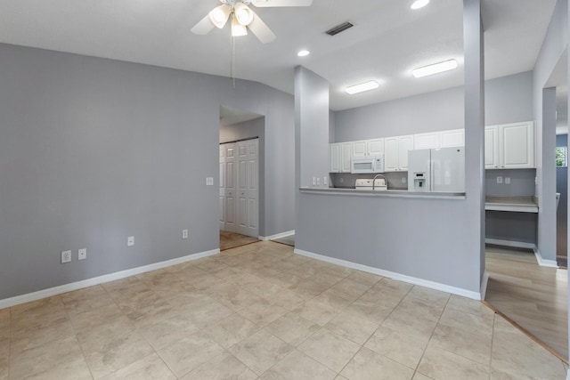 21211 Harbour Vista Cir, Saint Augustine, FL 32080 - spare room with a ceiling fan, vaulted ceiling, and recessed lighting