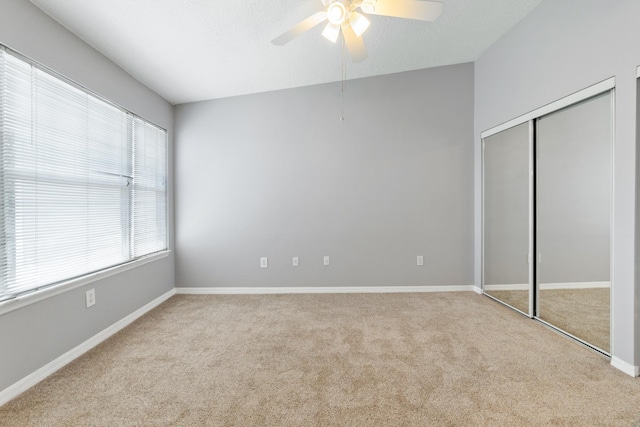21211 Harbour Vista Cir, Saint Augustine, FL 32080 - unfurnished bedroom with carpet floors, a closet, and ceiling fan