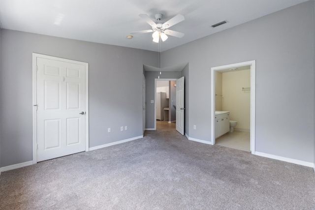21211 Harbour Vista Cir, Saint Augustine, FL 32080 - unfurnished bedroom with light colored carpet, ensuite bathroom, and a ceiling fan