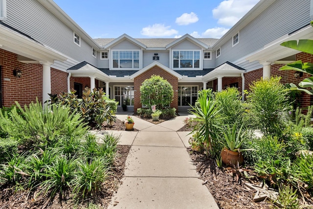 21211 Harbour Vista Cir, Saint Augustine, FL 32080 - view of front of house with brick siding and roof with shingles