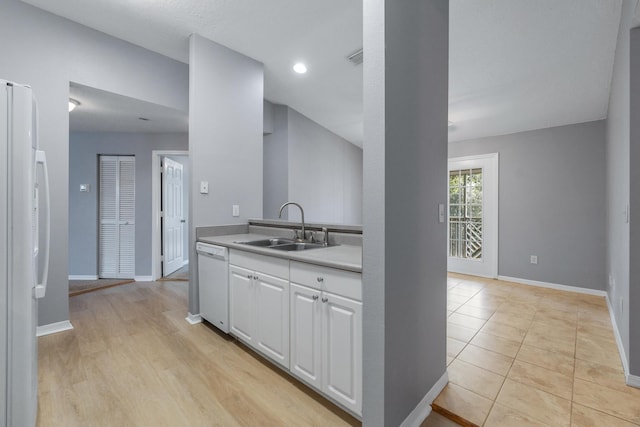 21211 Harbour Vista Cir, Saint Augustine, FL 32080 - kitchen featuring white appliances, white cabinets, and light countertops