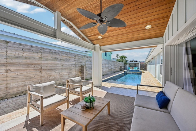 view of patio featuring a fenced in pool, outdoor lounge area, a fenced backyard, and a ceiling fan