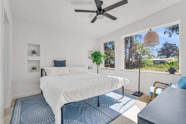 bedroom featuring light hardwood / wood-style floors and ceiling fan