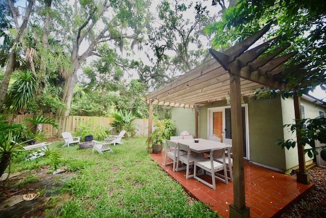 5 Nesbit Ave, Saint Augustine, FL 32084 - fenced yard with a pergola, a fire pit, outdoor dining space, and a deck