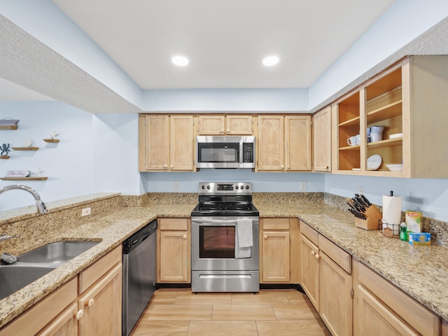 850 A1A Beach Blvd Unit 92, Saint Augustine, FL 32080 - kitchen featuring stainless steel appliances, light brown cabinets, a sink, light stone countertops, and recessed lighting