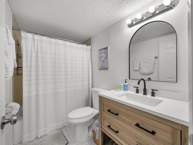 850 A1A Beach Blvd Unit 92, Saint Augustine, FL 32080 - bathroom featuring a textured ceiling, vanity, toilet, and tile patterned floors