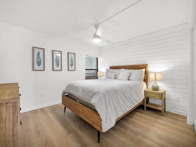 850 A1A Beach Blvd Unit 92, Saint Augustine, FL 32080 - bedroom featuring wood finished floors, a textured ceiling, baseboards, and a ceiling fan