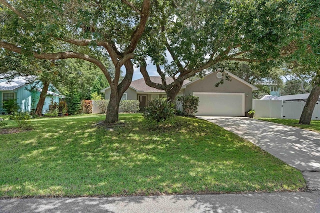 ranch-style home featuring a front lawn and a garage