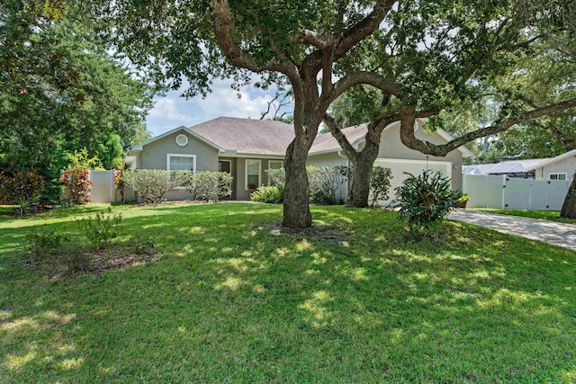 ranch-style home featuring a front yard