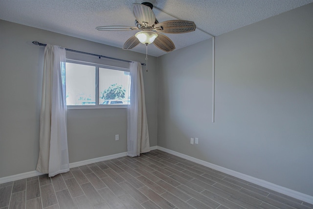 7175 A1A S A105, Saint Augustine, FL 32080 - empty room featuring a ceiling fan, baseboards, a textured ceiling, and wood finished floors