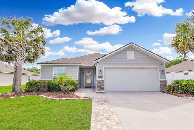 362 S Hamilton Springs Rd, Saint Augustine, FL 32084 - single story home with a front yard, an attached garage, driveway, and stone siding