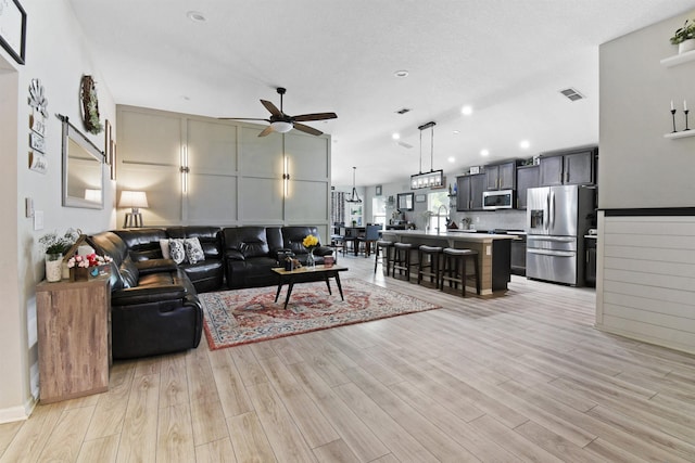 362 S Hamilton Springs Rd, Saint Augustine, FL 32084 - living room featuring a ceiling fan, light wood finished floors, and recessed lighting