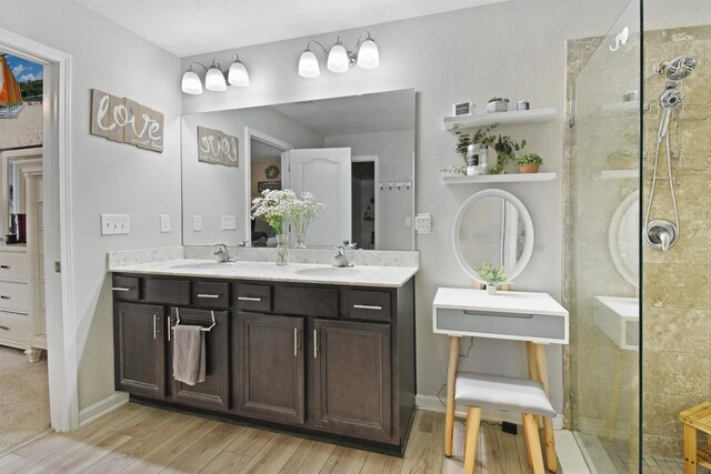 362 S Hamilton Springs Rd, Saint Augustine, FL 32084 - full bath with tiled shower, wood finished floors, double vanity, and baseboards