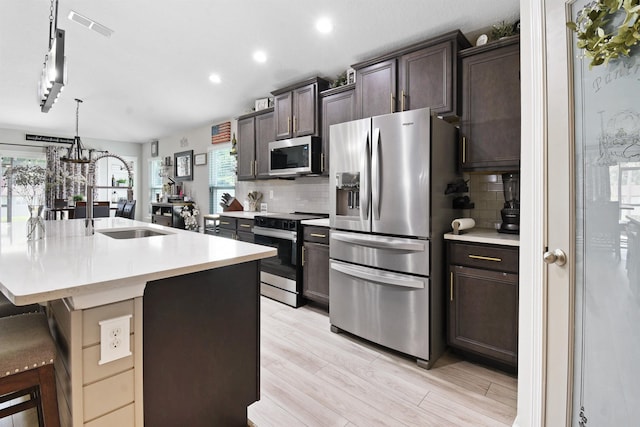 362 S Hamilton Springs Rd, Saint Augustine, FL 32084 - kitchen with appliances with stainless steel finishes, recessed lighting, dark brown cabinets, light countertops, and tasteful backsplash