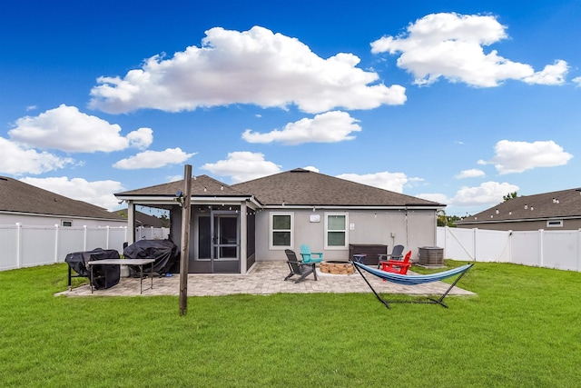 362 S Hamilton Springs Rd, Saint Augustine, FL 32084 - rear view of property featuring a fire pit, a patio area, stucco siding, and a shingled roof