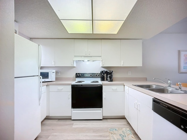 kitchen featuring white cabinetry, sink, white appliances, and light wood-type flooring