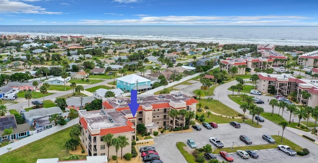 bird's eye view featuring a water view and a view of the beach