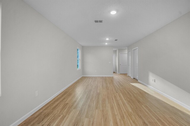 garage with a garage door opener and electric panel