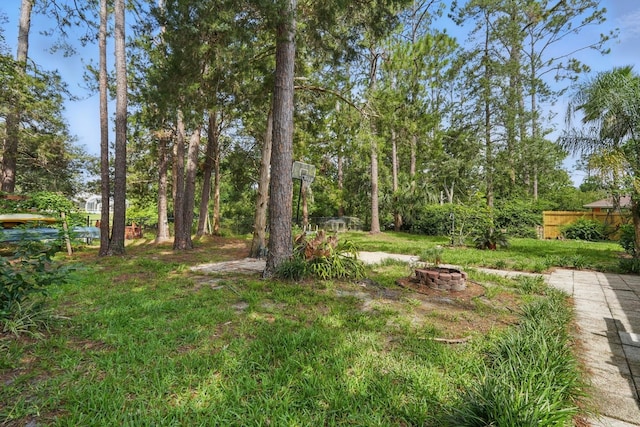 131 Boulder Rock Dr, Palm Coast, FL 32137 - view of yard with a fire pit