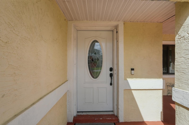131 Boulder Rock Dr, Palm Coast, FL 32137 - property entrance with stucco siding