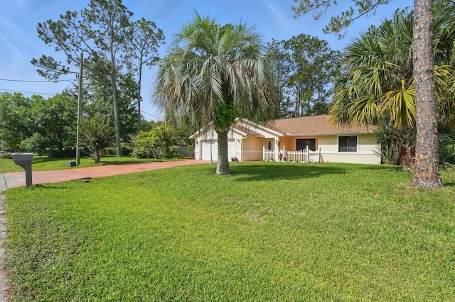 131 Boulder Rock Dr, Palm Coast, FL 32137 - view of front of home featuring stucco siding, driveway, and a garage