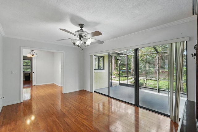 131 Boulder Rock Dr, Palm Coast, FL 32137 - spare room with hardwood / wood-style floors, a ceiling fan, crown molding, and a textured ceiling
