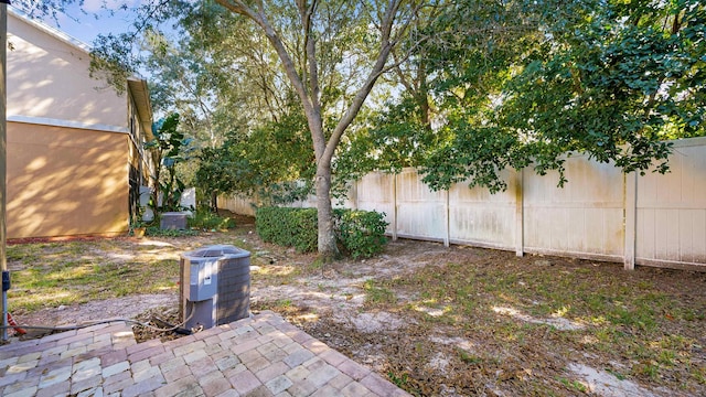 view of yard with central AC unit