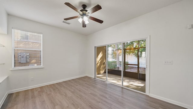 unfurnished room featuring ceiling fan and light hardwood / wood-style flooring