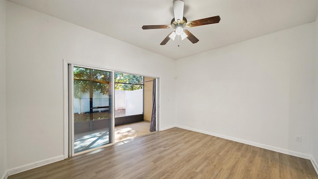 empty room with light hardwood / wood-style flooring and ceiling fan