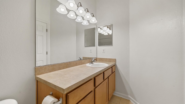 bathroom featuring tile patterned flooring and vanity