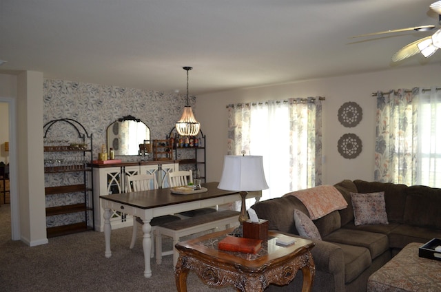 35 Putter Dr, Palm Coast, FL 32164 - carpeted living area featuring ceiling fan, wallpapered walls, and a chandelier