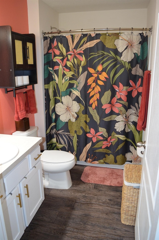 35 Putter Dr, Palm Coast, FL 32164 - full bath with wood finished floors, vanity, and a shower with shower curtain