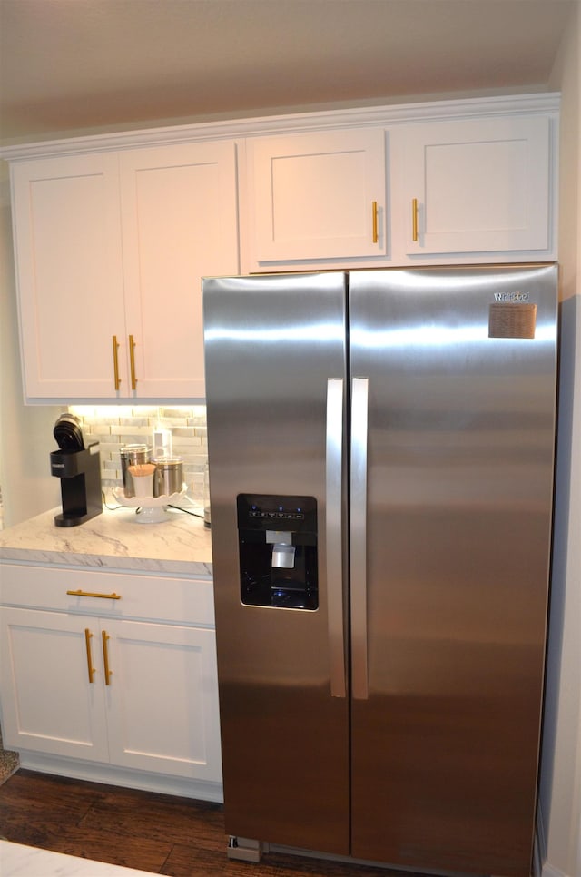 35 Putter Dr, Palm Coast, FL 32164 - kitchen featuring stainless steel fridge with ice dispenser, white cabinets, tasteful backsplash, and dark wood-style flooring