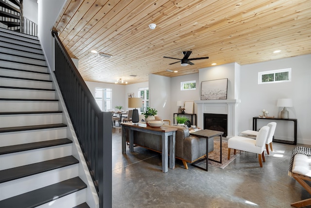 living room with ceiling fan and wooden ceiling