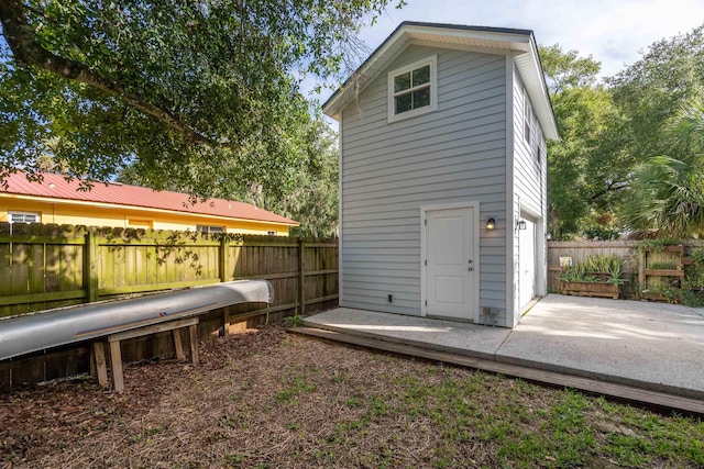 rear view of property featuring a wooden deck