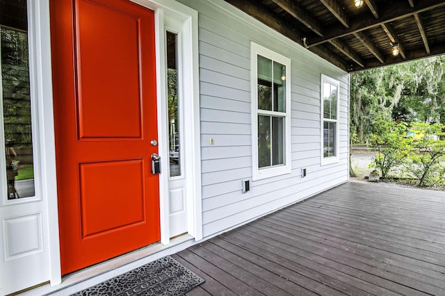 view of exterior entry with covered porch