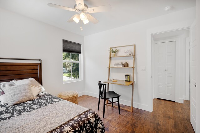 bedroom featuring ceiling fan and dark hardwood / wood-style floors