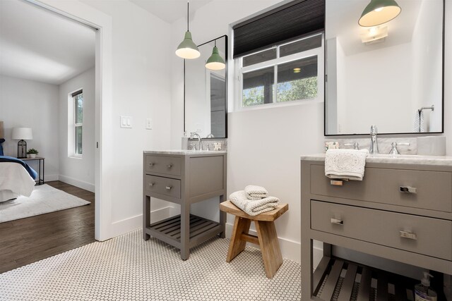 bathroom with hardwood / wood-style floors and vanity