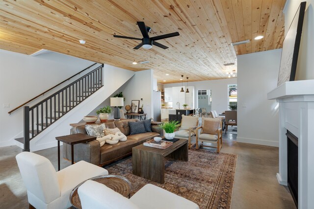 living room with ceiling fan and wood ceiling