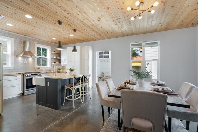 dining room featuring a notable chandelier, wooden ceiling, and sink