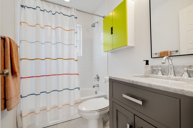 full bathroom featuring tile patterned flooring, shower / tub combo with curtain, vanity, and toilet