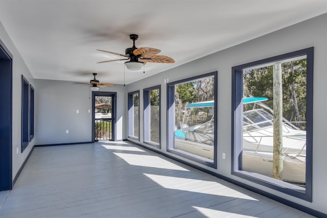 unfurnished room with light hardwood / wood-style floors and ceiling fan