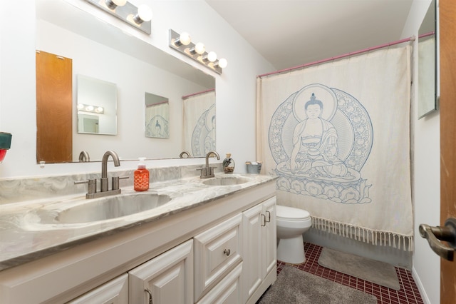 bathroom featuring tile patterned flooring, vanity, and toilet