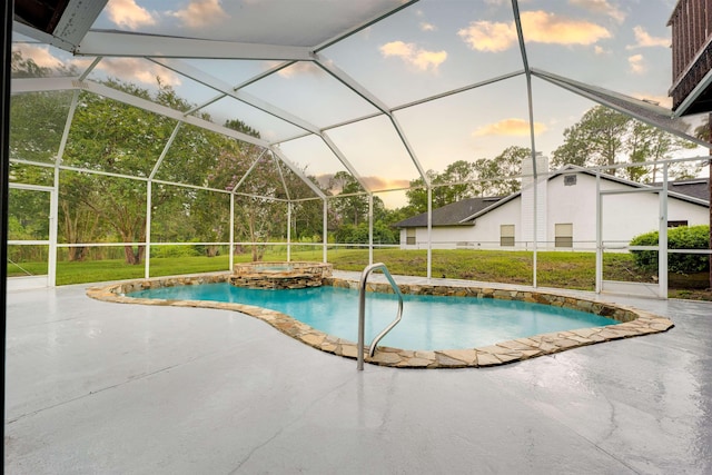 pool at dusk featuring glass enclosure, a yard, and a patio