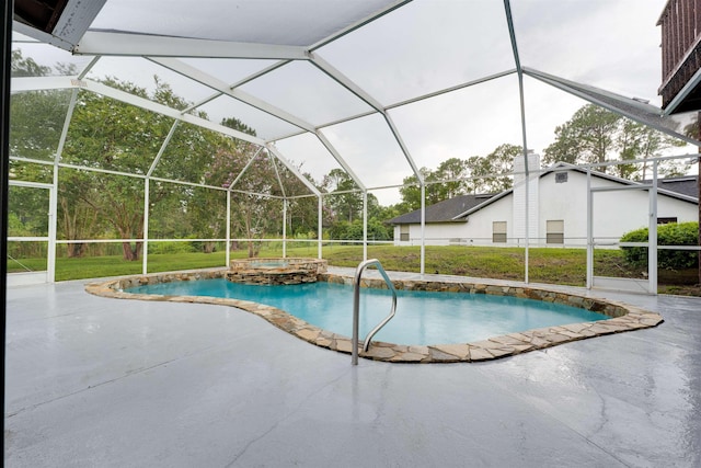 view of pool with a lawn, a patio area, and a lanai