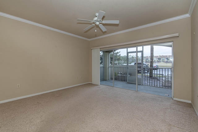 spare room with crown molding, ceiling fan, and carpet floors